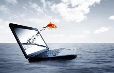 Goldfish jump out of the monitor clipart