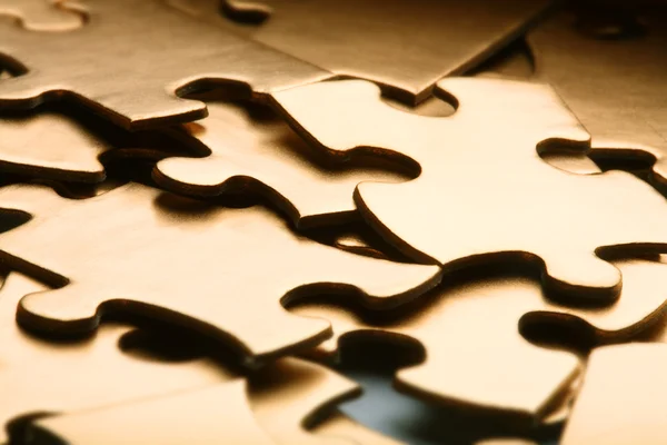 Golden jigsaw — Stock Photo, Image