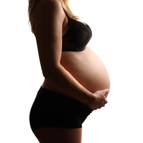 Těhotné břicho, izolované proti Bílému pozadí — Stock fotografie