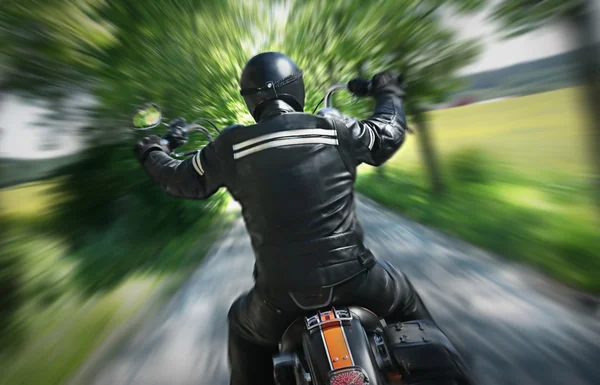 Lone motorbike rider — Stockfoto