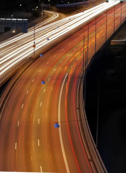 Night time shot of speeding traffic on a freeway — Stok fotoğraf