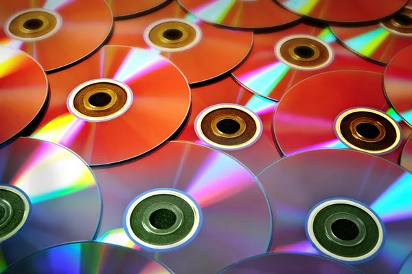 Bakgrund av några färgglada CD-skivor — Stockfoto