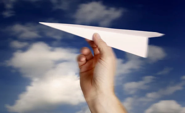 Throwing a paper plane.. — Stock Photo, Image