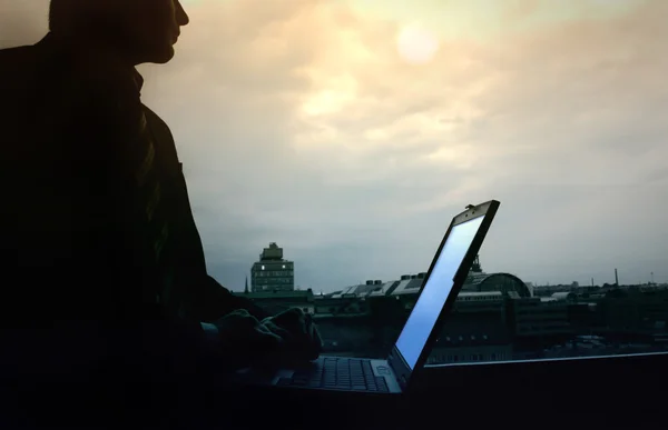 Young man with laptop — Stock Photo, Image