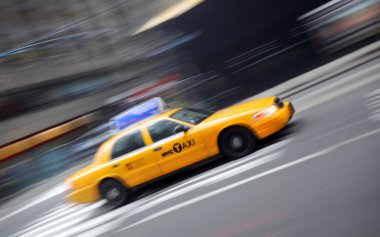 Motion blur image of yellow Taxi