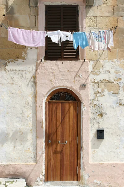Washing line in front of a window — Stock Photo, Image