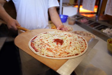 Man Making a Pizza clipart