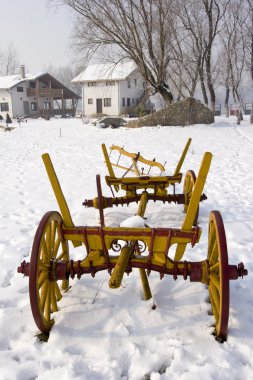 Old cart in the snow clipart