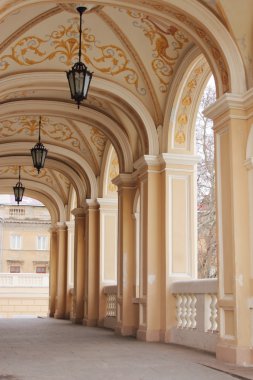 Arch.Lateral arch of the Odessa opera theater with lanterns clipart