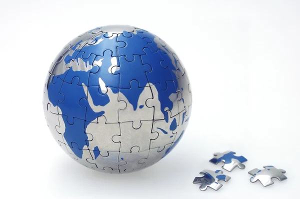 Globe collected from puzzle parts — Stock Photo, Image