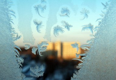 Winter patterns at a window clipart