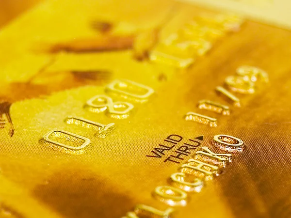 Tarjeta de crédito de oro Imagen de stock
