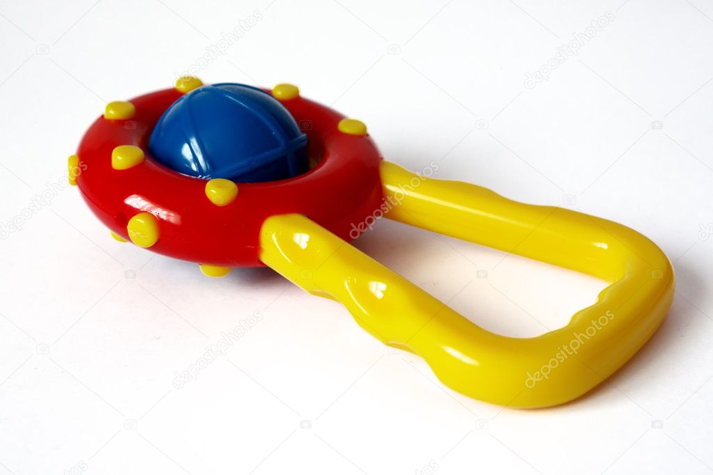 Funny rattle toy isolated on white background