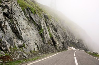 Dangerous road an foggy condition in Transfagarasan clipart