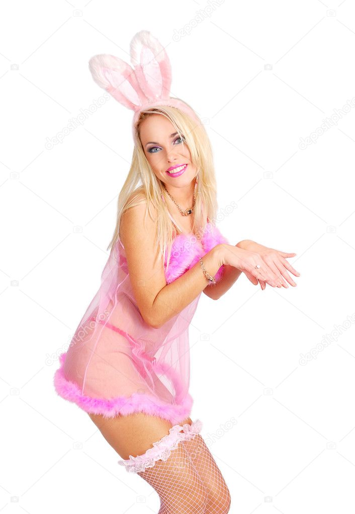 Playboy girl in a rose baby-doll and rabbit ears is posing