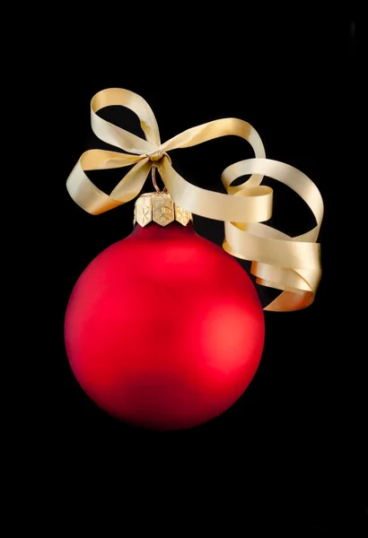 One red satin Christmas ball with gold ribbon — Stock Photo, Image