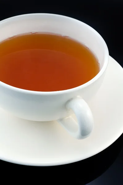 stock image Cup of tea on black bacground