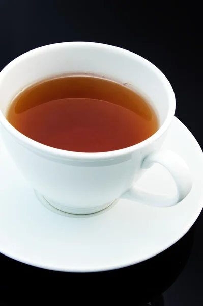 stock image Cup of tea on black background