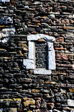 Window in old stone wall clipart