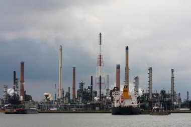 Refinery in Antwerp with ship clipart