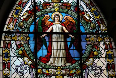 Stained glass window depicting an angel in the German Church in Gamla Stan, Stockholm. clipart