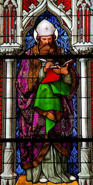 stock image Church window in the Dom of Cologne, Germany, depicting Saint Augustinus, one of the four Latin Church Fathers.
