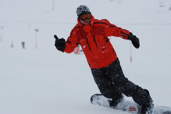 Snowboarder in volle tevredenheid — Stockfoto