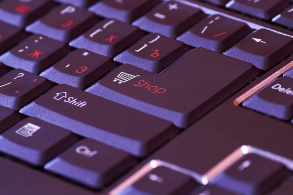 Black keyboard with a basket icon and a red word shop on enter button — Stock Photo, Image