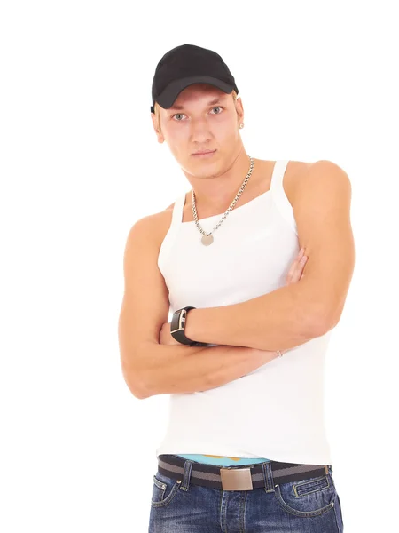 Muskulöser Mann in weißem Tanktop, blauer Jeans und schwarzer Mütze — Stockfoto