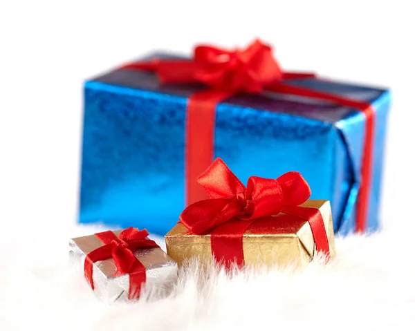 Two small gift boxes over the big one isolated on white — Stock Photo, Image