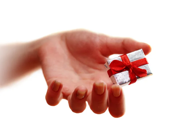 Hand and gift. Emphasis on gift — Stock Photo, Image