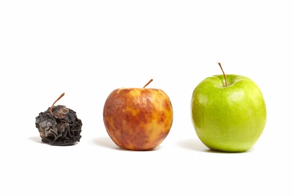 Tři jablka: svěží, hnijící a mrtvé Stock Snímky