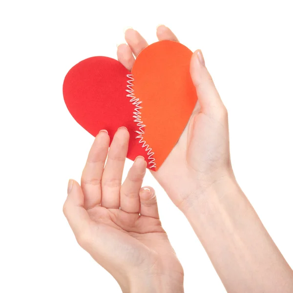 Stitched broken heart in woman's hands — Stock Photo, Image