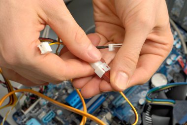 Technician's hands at work clipart