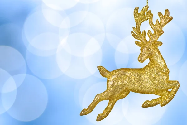 Різдвяний фон боке з золотими оленями — стокове фото