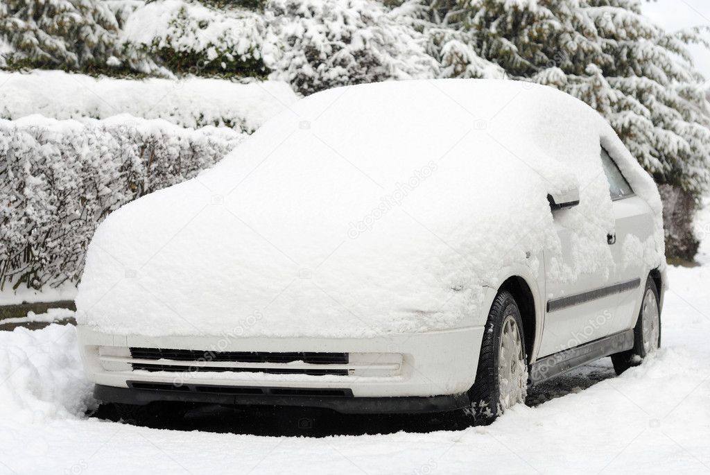 Snow-covered white car