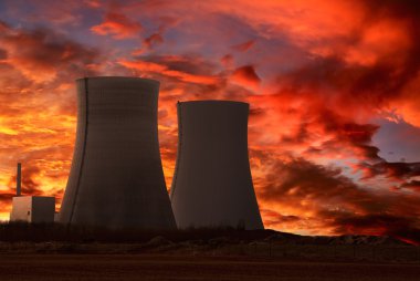 Nuclear power plant with an intense red sky clipart