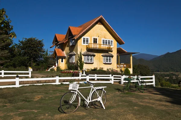 stock image Yellow classic house on hill in pai district