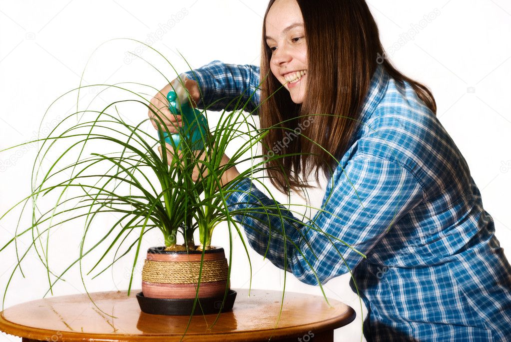 Woman spraing the plant