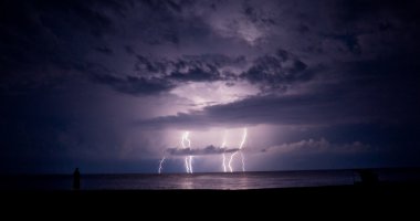 Thunder-storm in the sea. A lightning. clipart