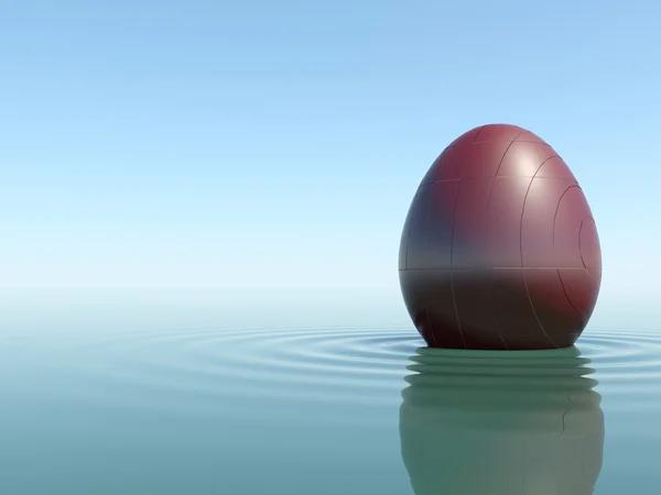 Su üstünde kırmızı taş yumurta — Stok fotoğraf
