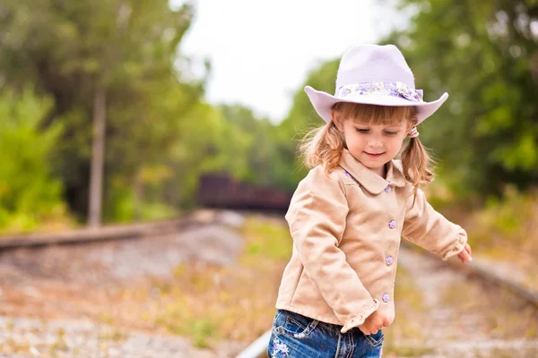 Cawgirl on the railway — Stock Photo, Image
