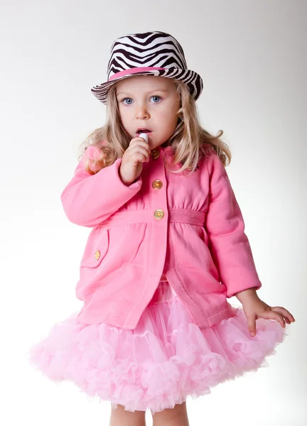 Beautiful sweet toddler girl in pettiskirt and zebra hat — Stock Photo, Image