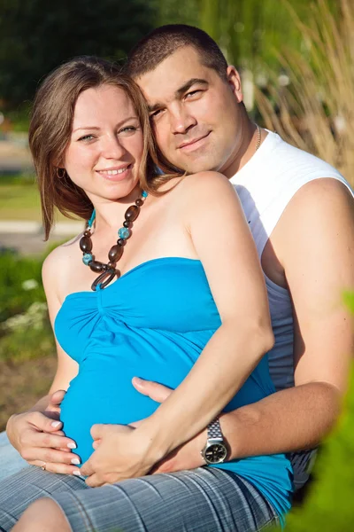 stock image Happy husband embracing pregnant wife