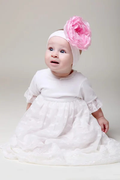 Beautiful baby girl in celebratory dress — Stock Photo, Image