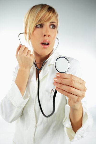Nurse with the stethoscope, looking scared and surprised