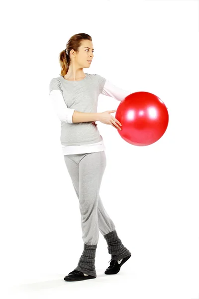 Girl exercising with a red ball 3 — Stock Photo, Image