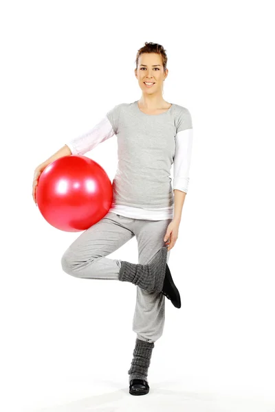 Flicka som håller en röd boll 2 — Stockfoto