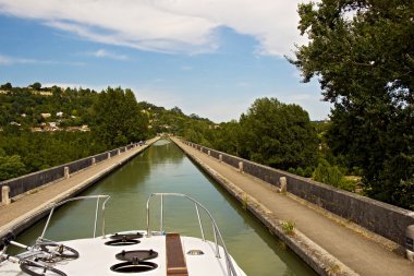 Pleasure boating along the canals clipart