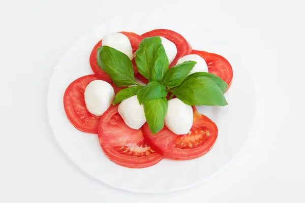 Tomatoes with mozzarella — Stockfoto